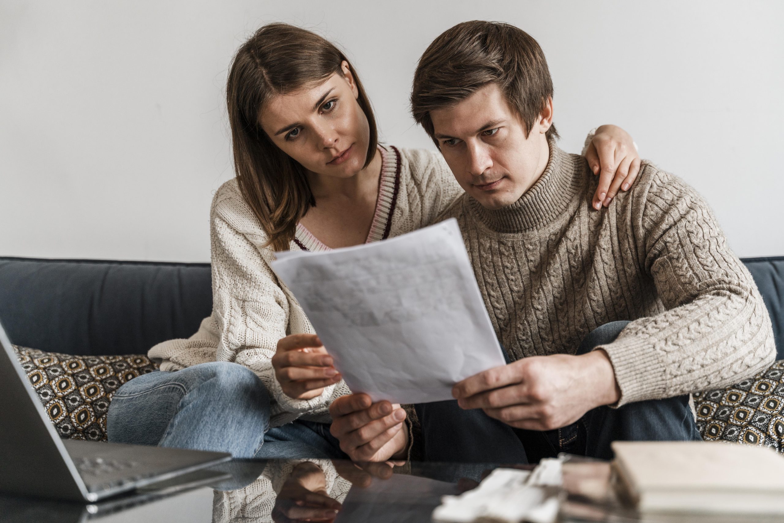 close-up-couple-reading-document